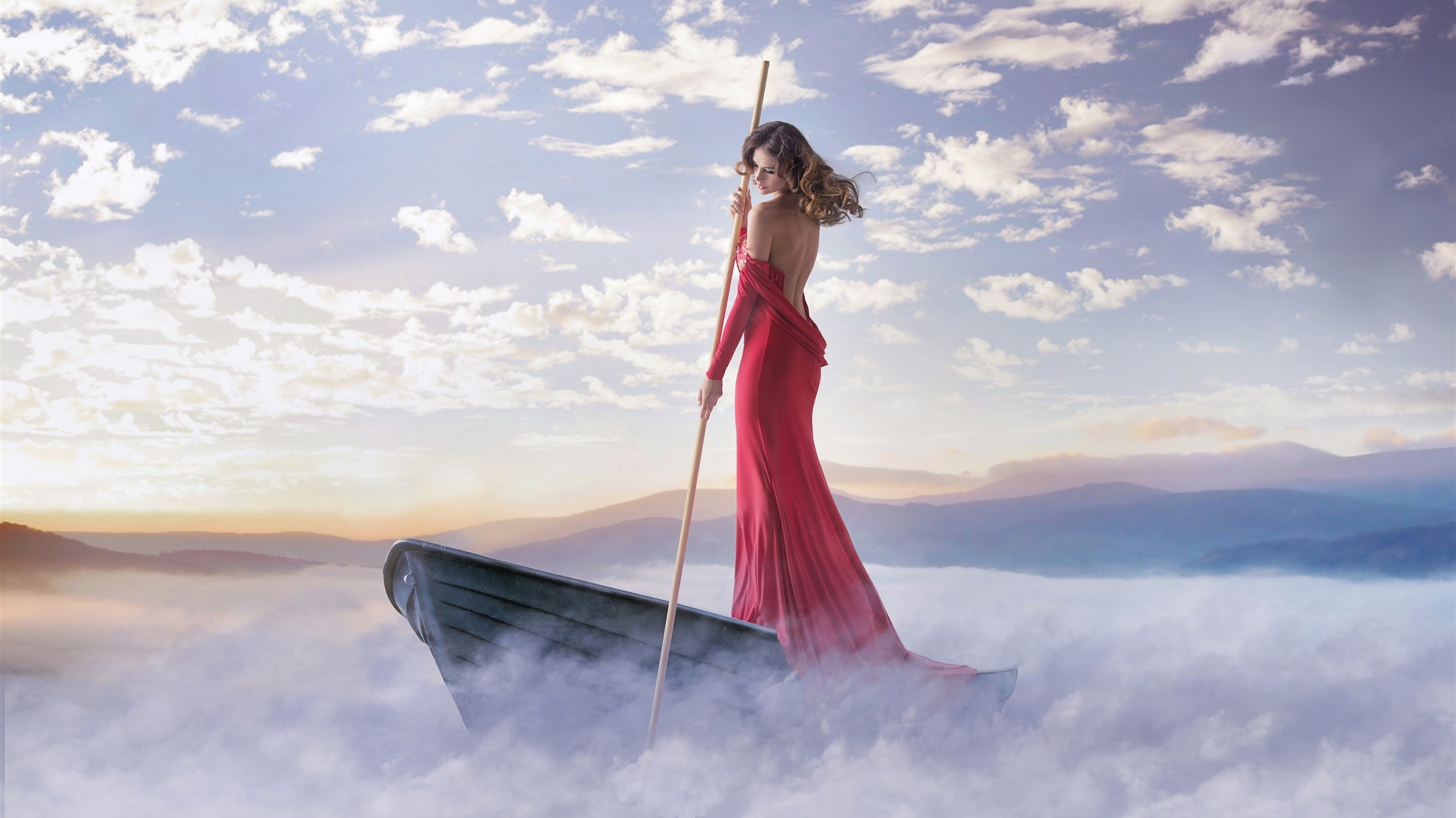 Red-dress-girl-boat-fog-clouds-coast_2560x1440.jpg